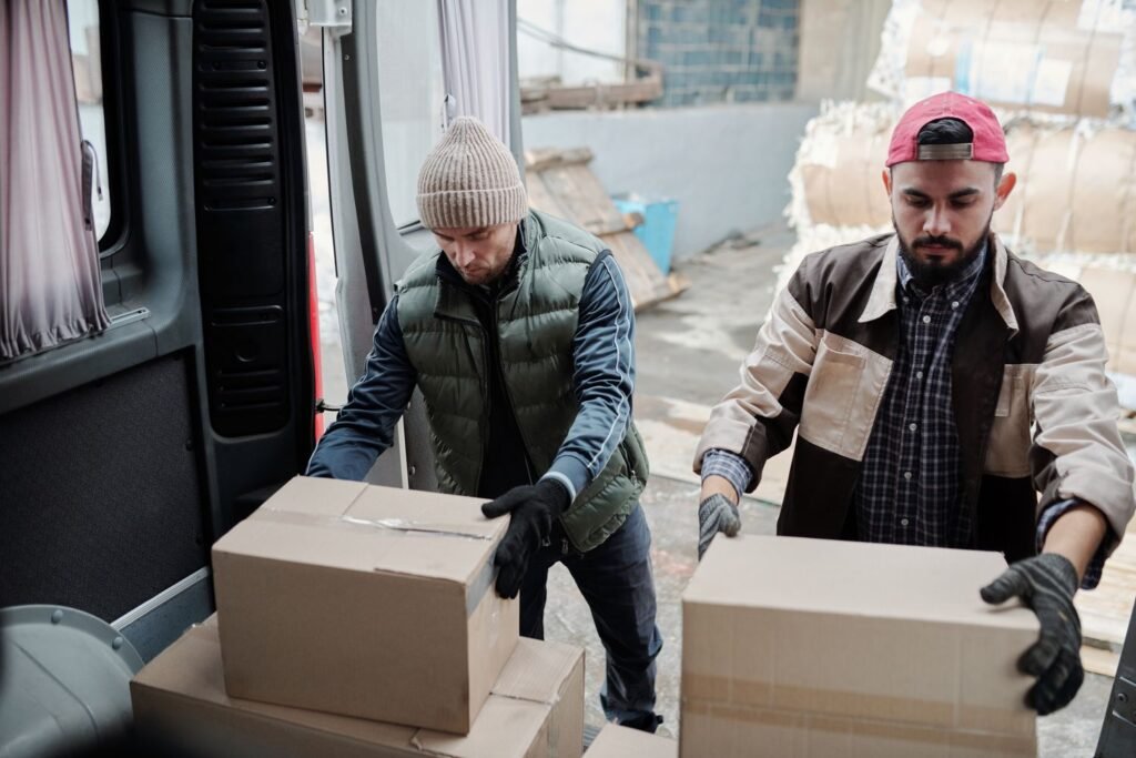 Warehouse operatives packing cartons