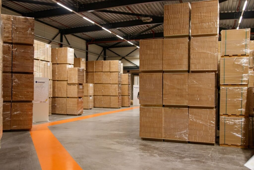 Cartons stacked in a warehouse aisle